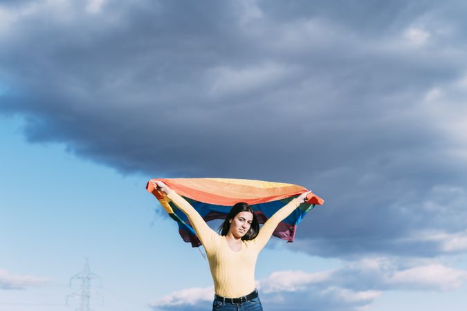 Young woman with gay flag