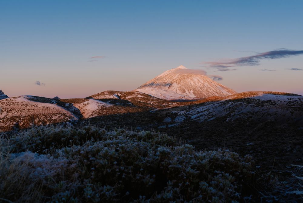 Clouds near snowy mountain