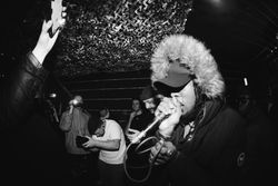 Young musician holding microphone in live performance