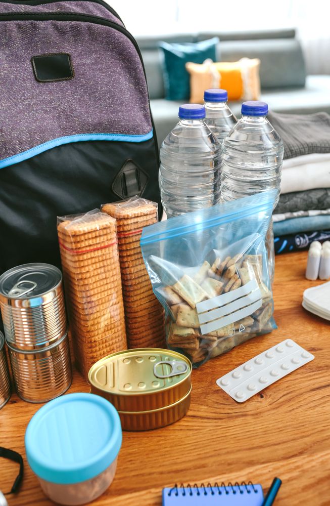 Emergency backpack equipment organized on the table