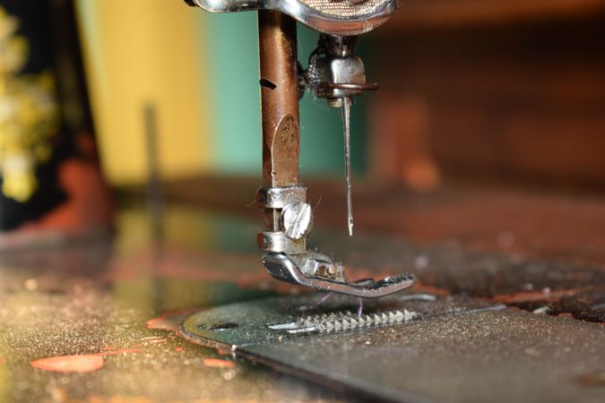Close up side view of metallic sewing machine