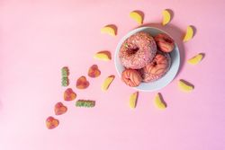 Pink doughnuts in a flower shape made with candies