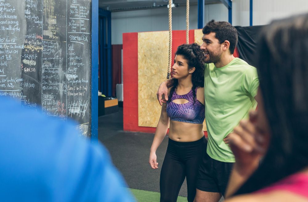Couple of athletes looking at results