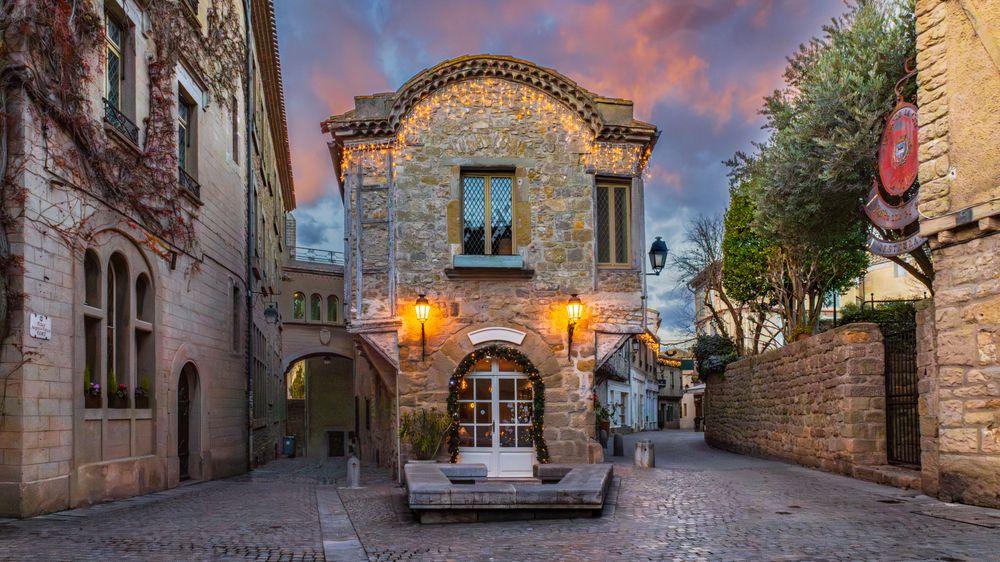 Square Auguste Pierre Pont in fortified city of Carcassonne. A small town with a stone building with a window on the front
