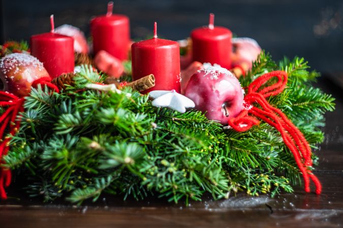 Side view of Christmas wreath with red candles