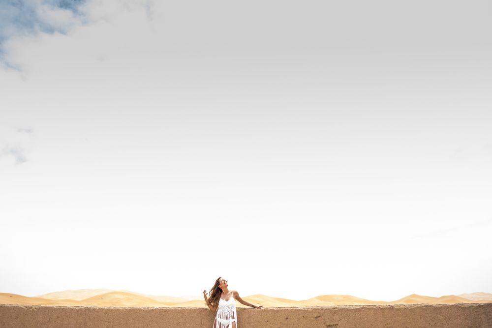 Woman on terrace against desert landscape