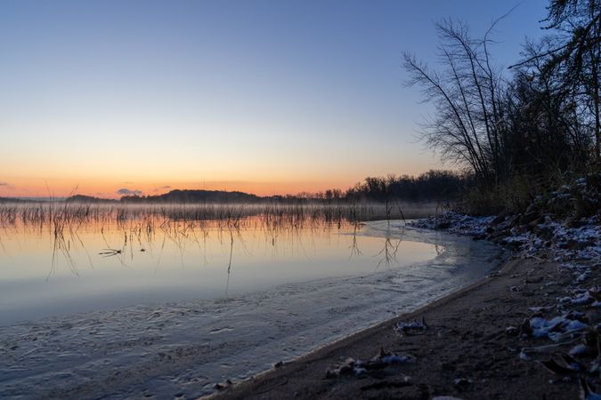 Sunrise and icy edges on Big Sandy Lake in McGregor, Minnesota
