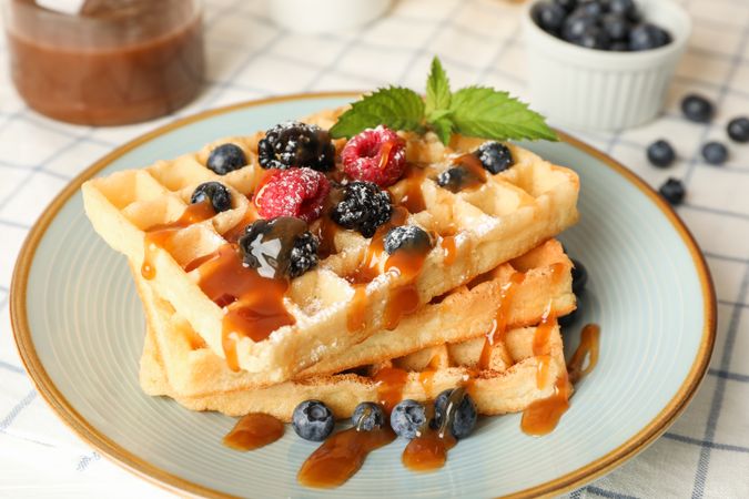 Composition of breakfast with belgian waffles, space for text