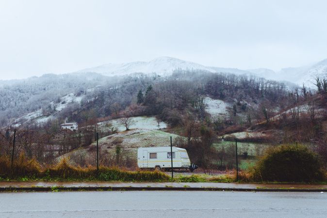 Mobile home parked near hills