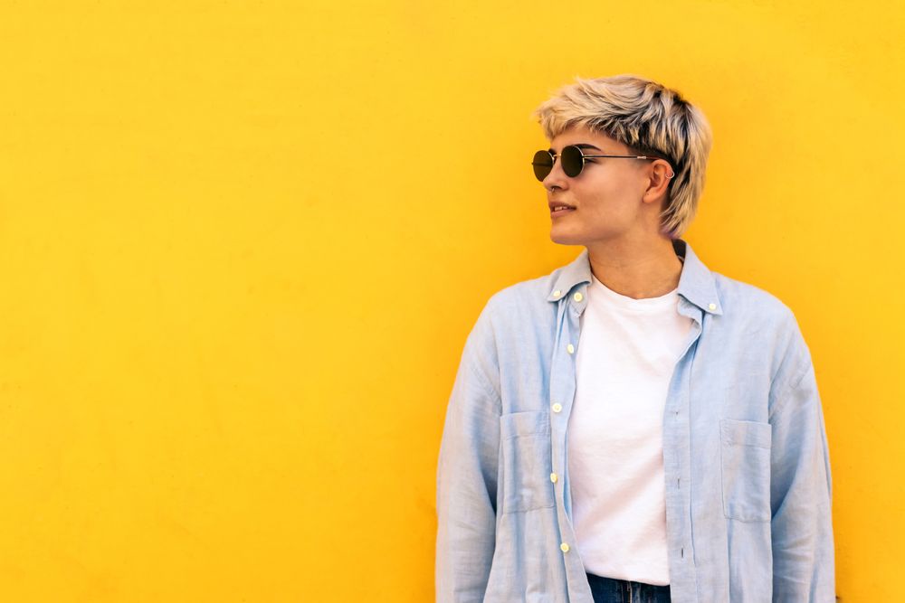 stylish young woman with short hair, sunglasses, portrait