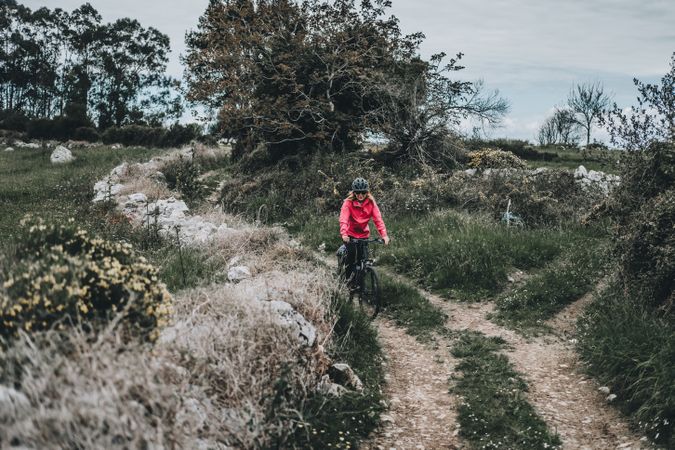 Female riding bicycle on countryside