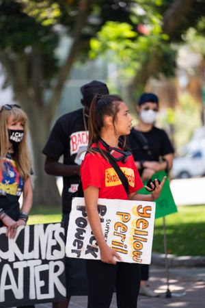 Los Angeles, CA, USA — June 16th, 2020: side view of woman speaking to activists at protest rally