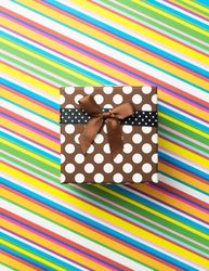 Brown dotted present on diagonal stripped pattern background
