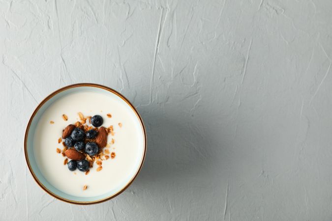 Bowl with parfaits dessert on cement background