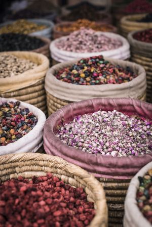 Baskets with dried spices on marketplace