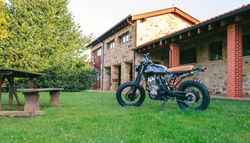 Custom motorcycle parked on the grass