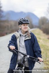 Woman taking a break during a bicycle ride 42Led0