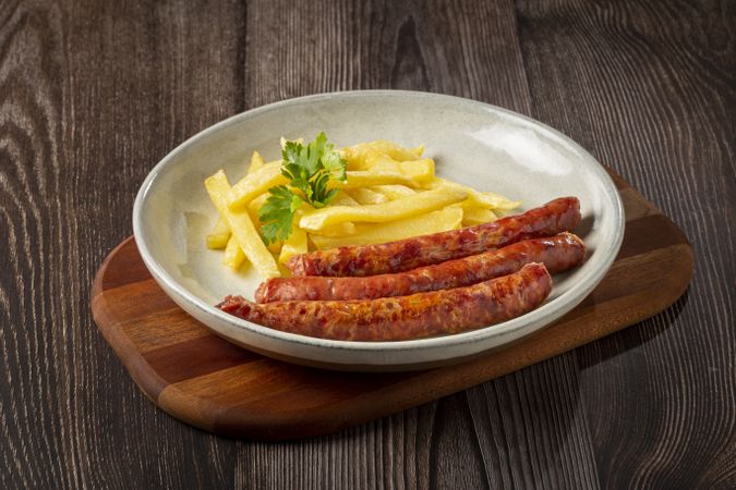 Grilled German sausage with french fries.