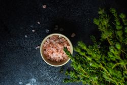 Top view of salt and herbs