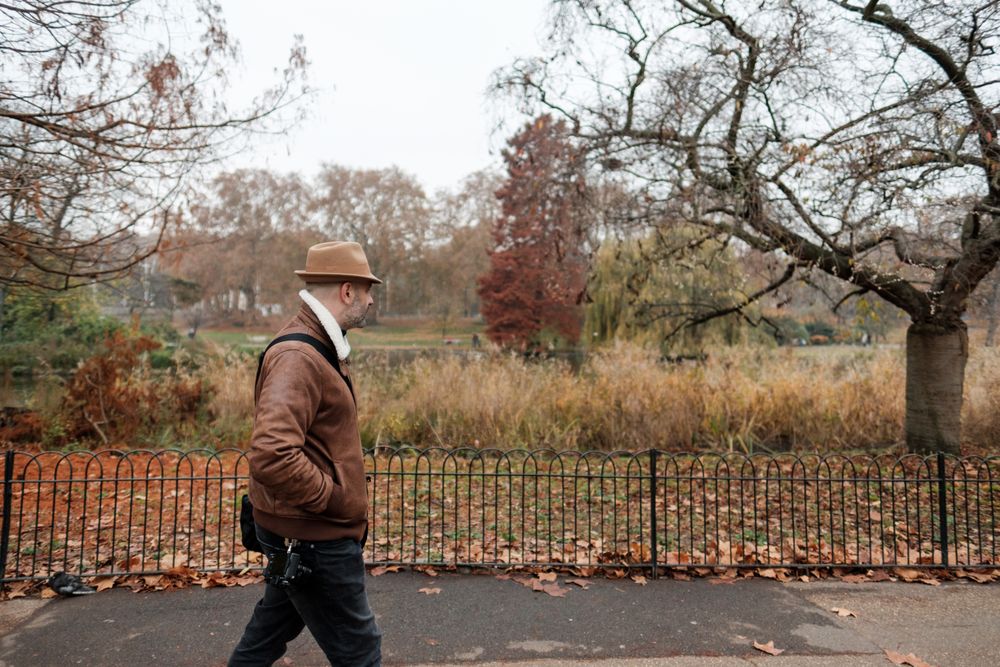 Relaxed man walking near park