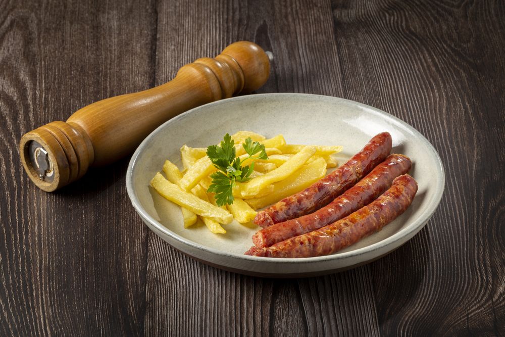 Grilled German sausage with french fries.