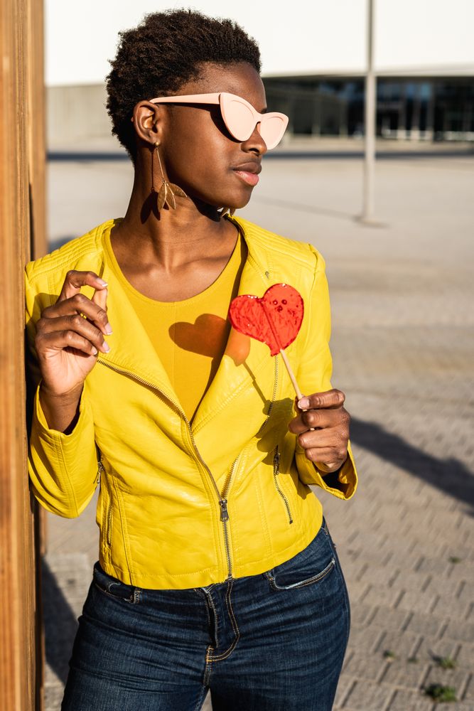 Black woman eating candy