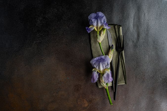 Table setting with pale blue iris flowers