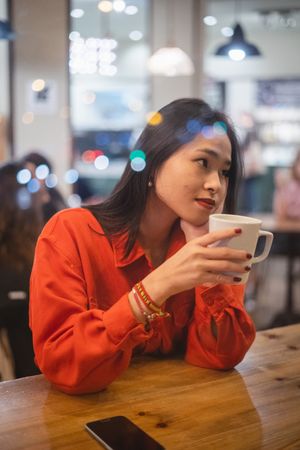 Woman having a cup of coffee