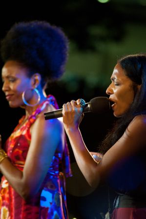 Los Angeles, CA, USA - July 12, 2012: Woman passionately singing with microphone