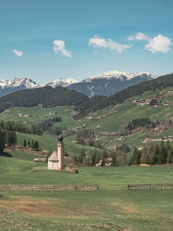 Small beautiful village between mountains with snow