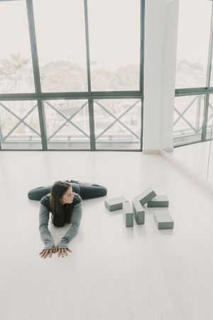 Flexible female stretching in studio