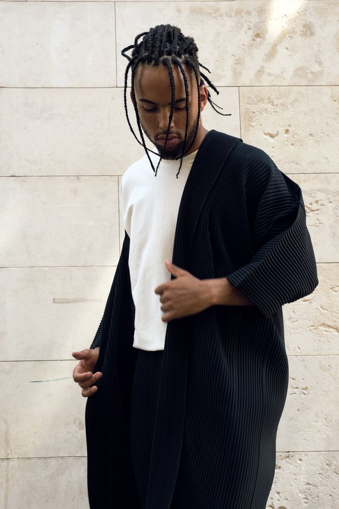 Trendy Black man posing on street