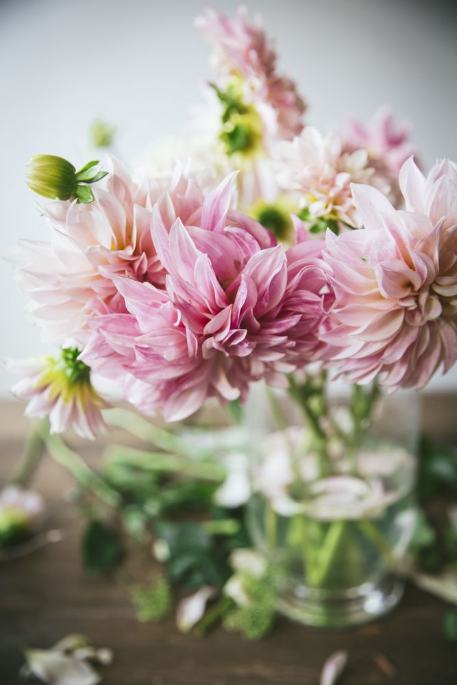 Bunch of flowers in vase on table