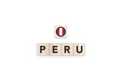 Wooden blocks bearing the name and flag of Peru.
