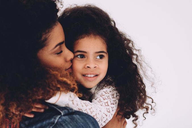 Mother holding her young daughter