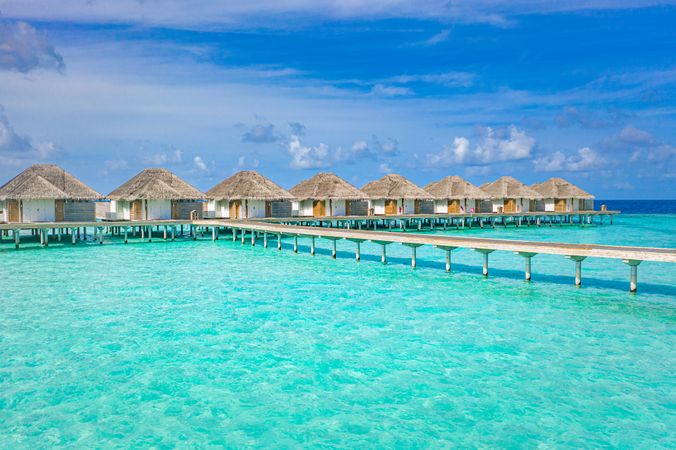 Walkway on the way to overwater bungalows in a resort, landscape