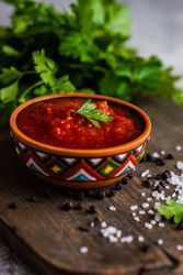 Traditional Georgian sauce - satsebeli with parsley garnish