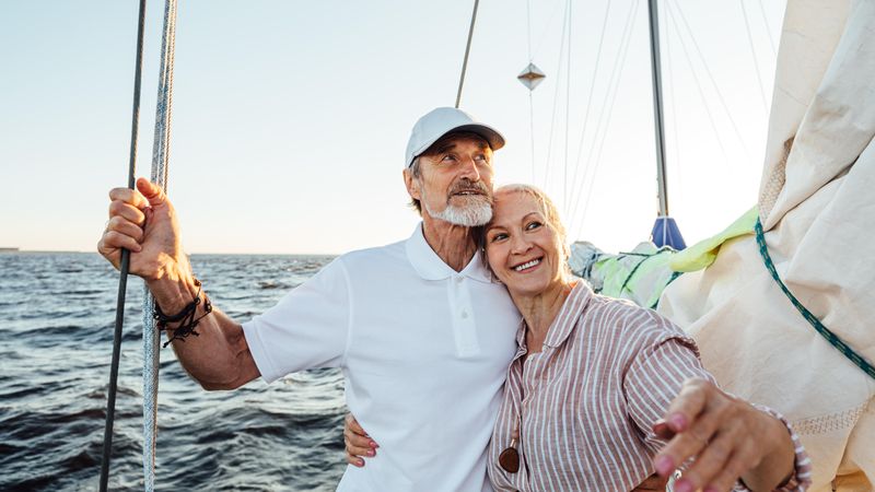 Content older couple sailing together