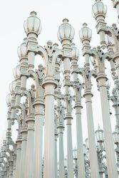 row with high silver column lantern and touching hair in Los Angeles