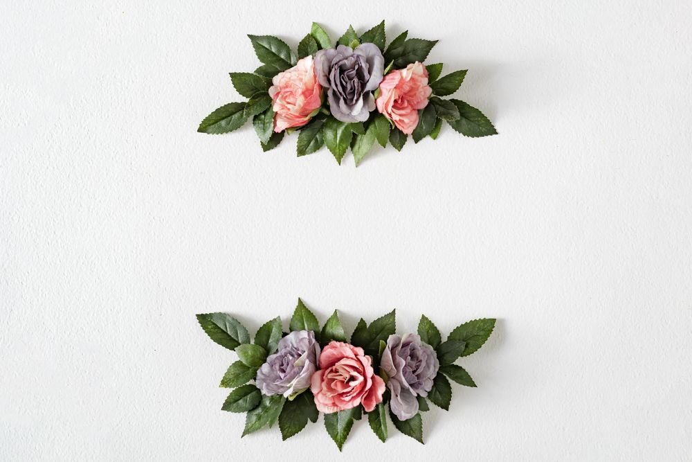 Pink and purple flowers and leaves on bright background