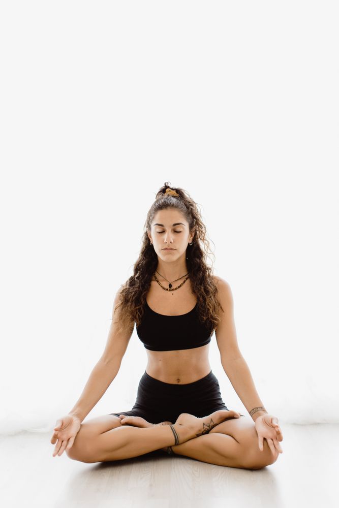 Woman meditating in lotus position