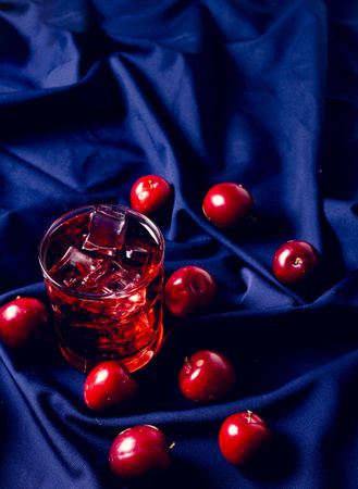 Red drink near fresh fruits
