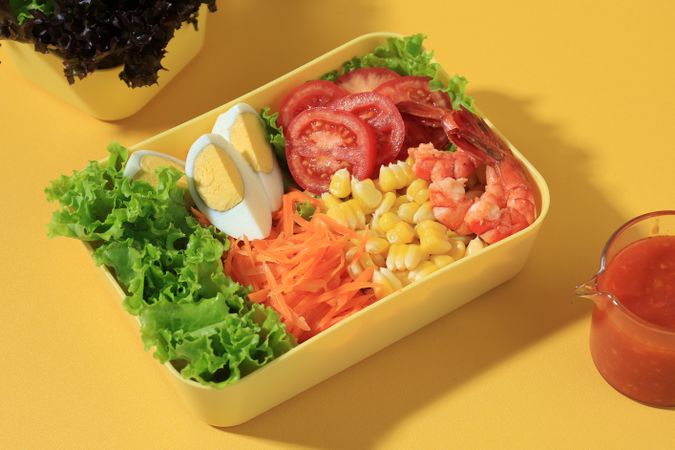 Fresh Shrimp Salad with Quail Eggs, Tomato, Lettuce, Edamame, Corn, and Carrot.