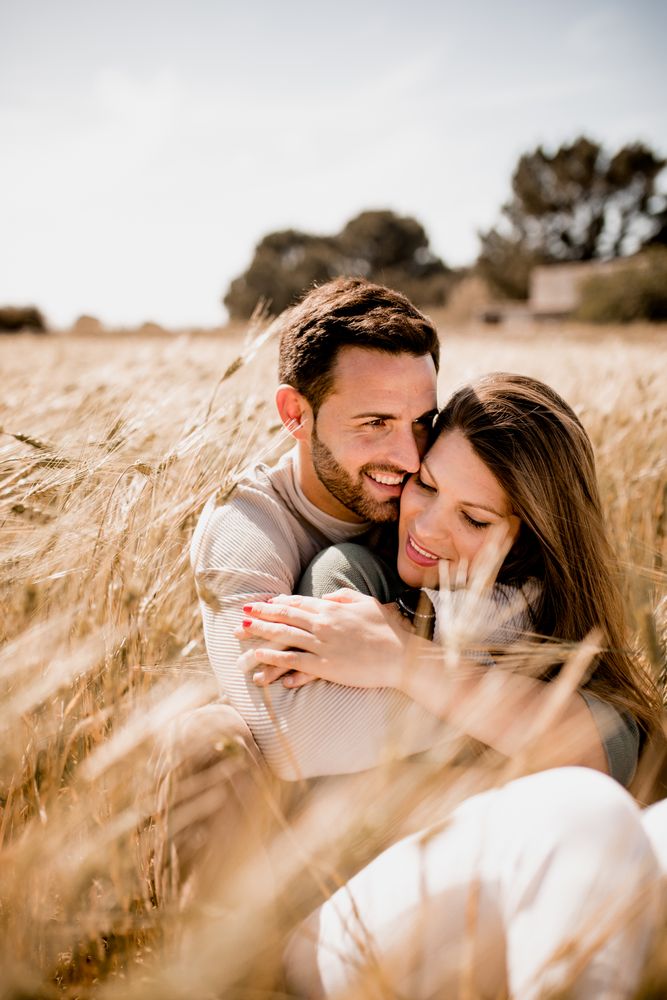 Serene lovers embracing on wheat field