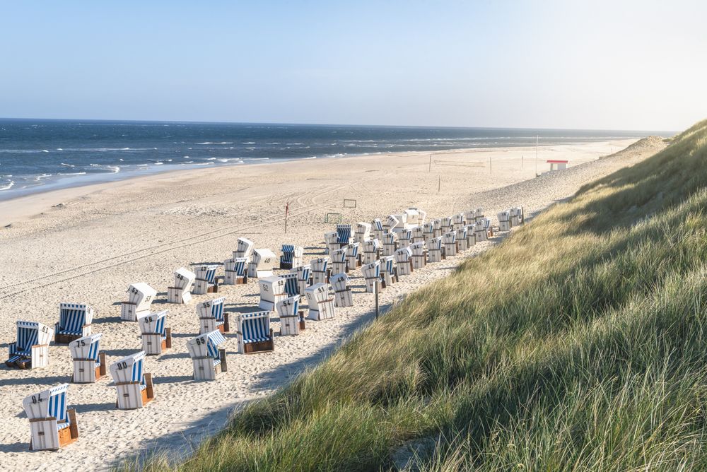 Beach front with chairs and sport setups