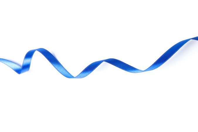 Blue ribbon isolated on plain background. Gift concept