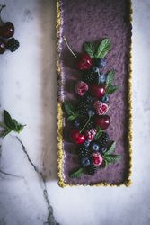 Fresh blueberry pistachio cake with whole berries on top