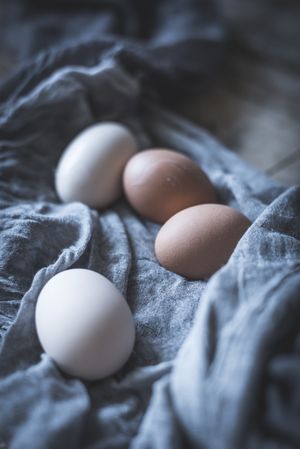 Raw eggs on tablecloth