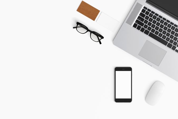 Modern workspace with coffee cup, smartphone, paper, notebook, tablet and laptop copy space