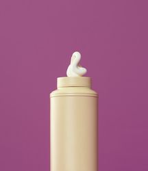 Mayo bottle isolated on purple background